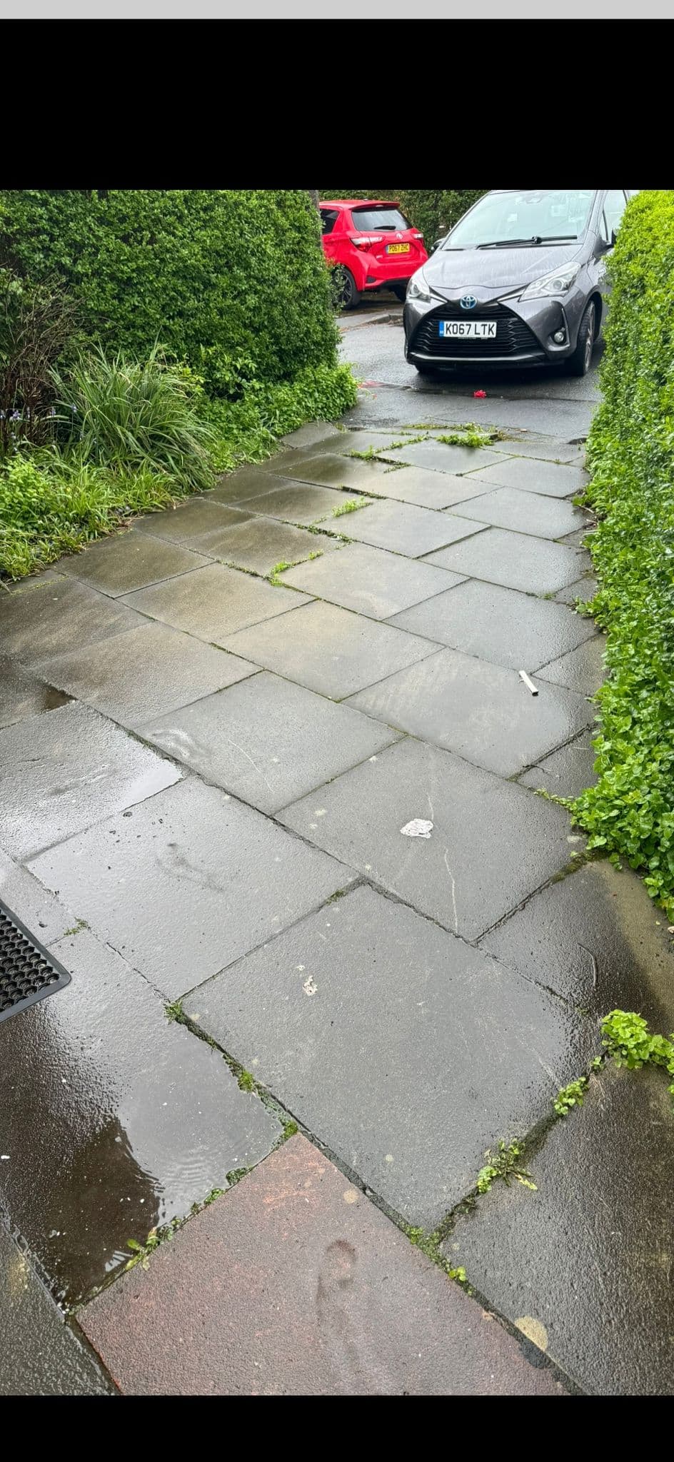 Extended patio with boundary fencing and raised planters